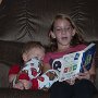 Melanie and Daniel reading together.